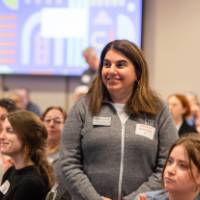 person standing at table photo 3